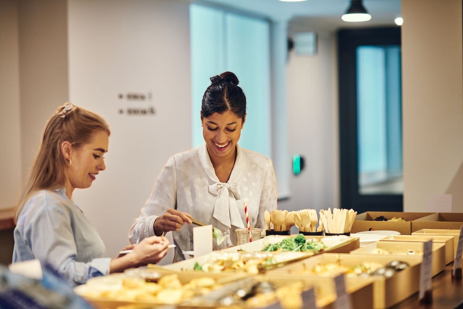 Attendees networking at a vibrant catering station in Salisbury House event.