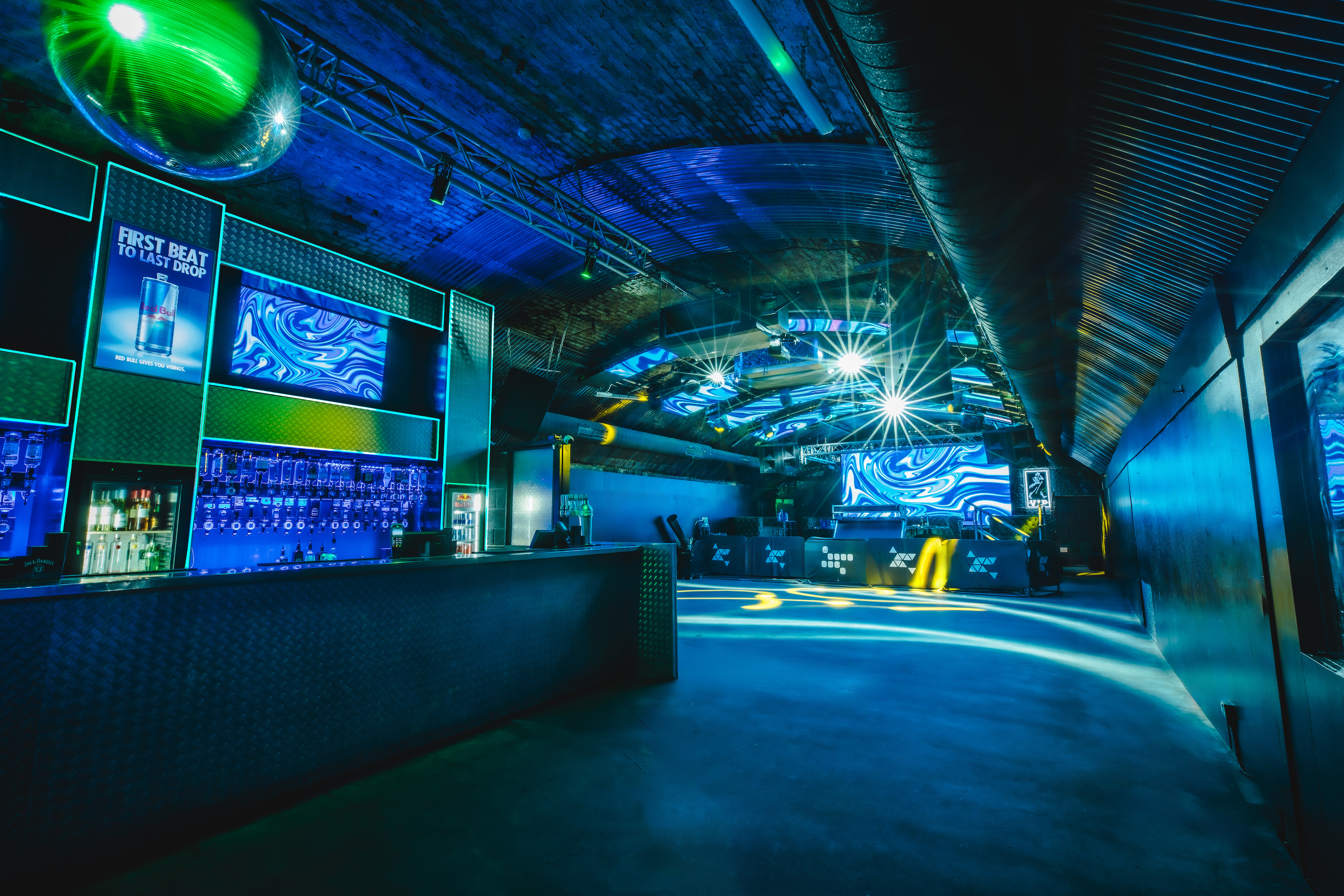 Fire Mirror Arch event space with dynamic lighting for corporate events and private parties.