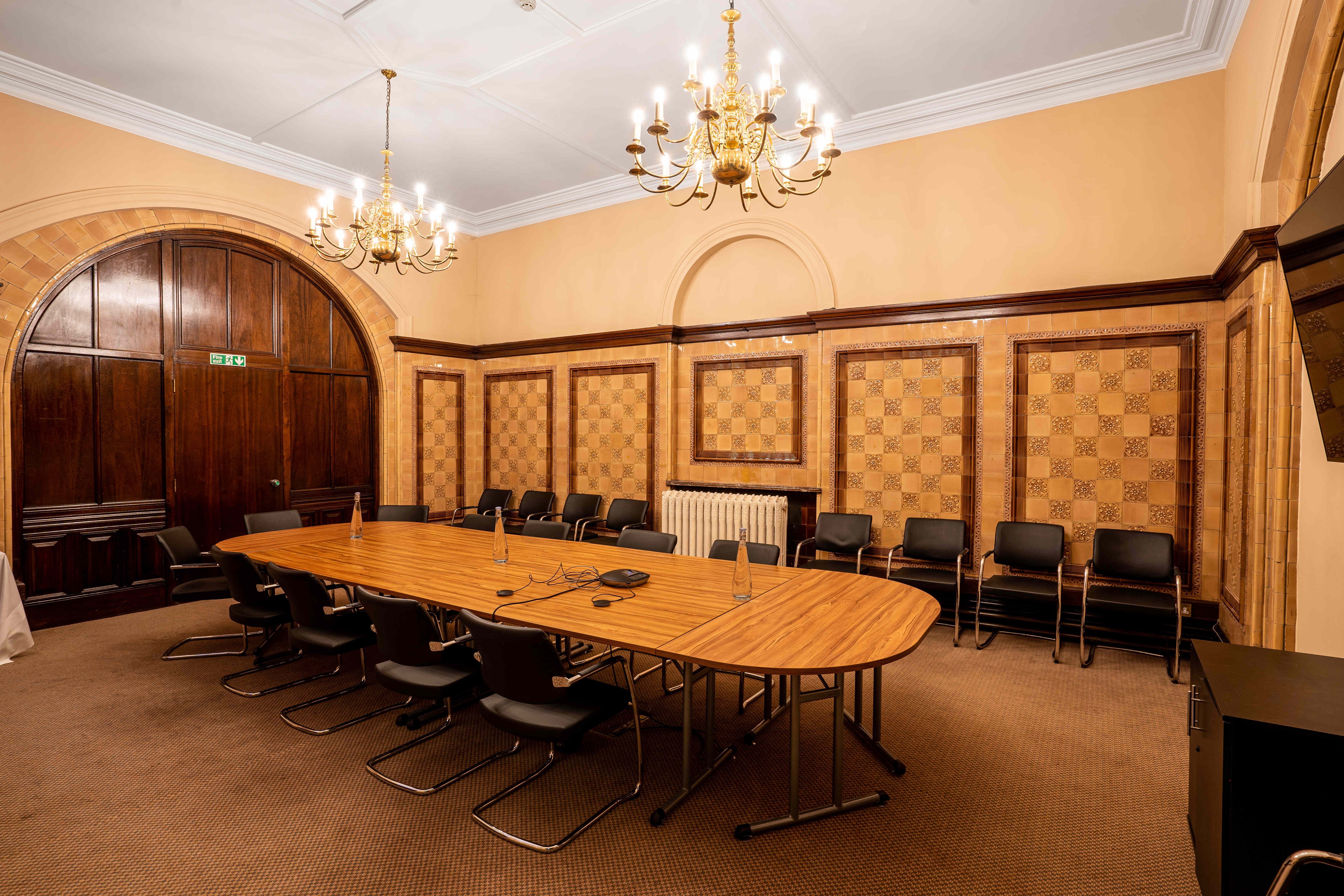 Naoroji Room at National Liberal Club, elegant meeting space with oval table, ideal for conferences.