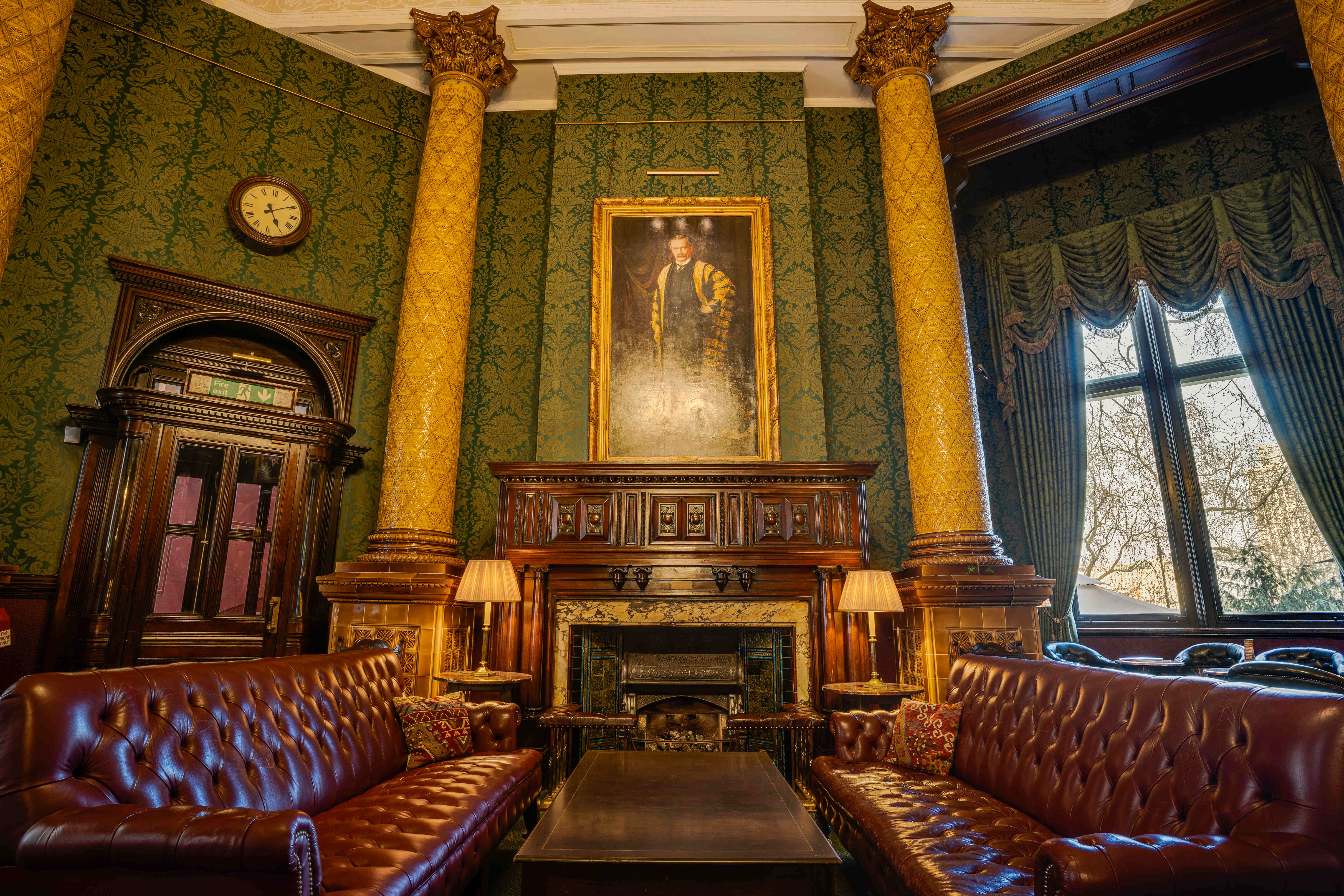 Elegant Smoking Room at National Liberal Club with plush leather seating for exclusive events.