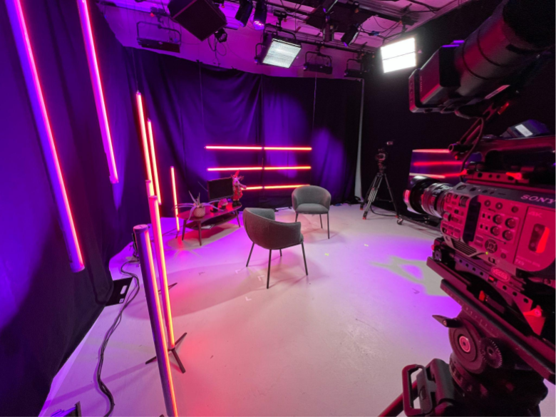 Modern Great West Studio with neon lighting for virtual events and hybrid meetings.