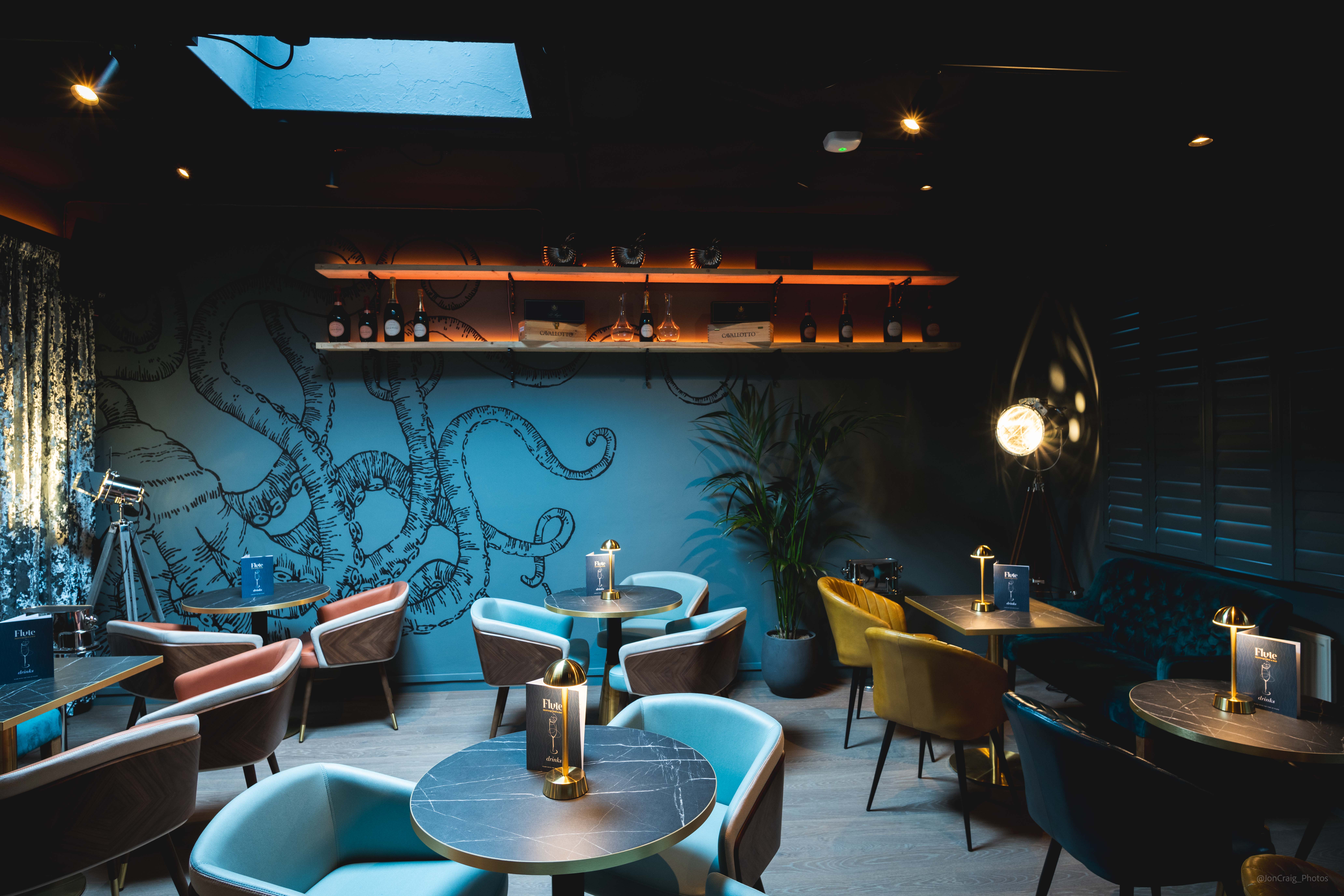Stylish venue with octopus mural, ideal for networking events and team gatherings.