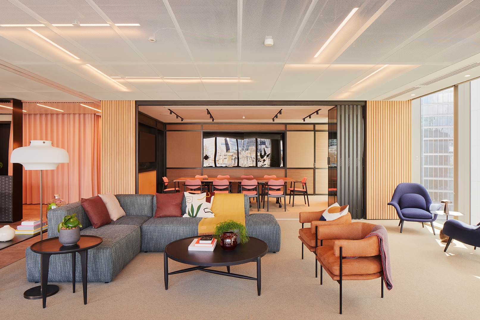 Modern meeting space with cozy seating and natural light at Myo Liverpool Street.