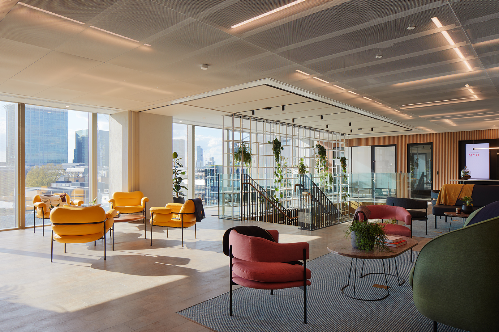 Modern meeting space with vibrant furniture for networking events in Liverpool Street.