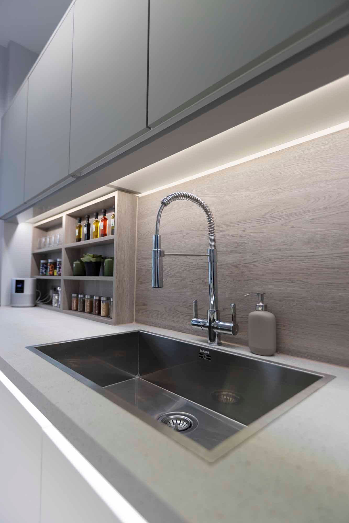 Modern kitchen setup with sleek faucet for events and catering efficiency.