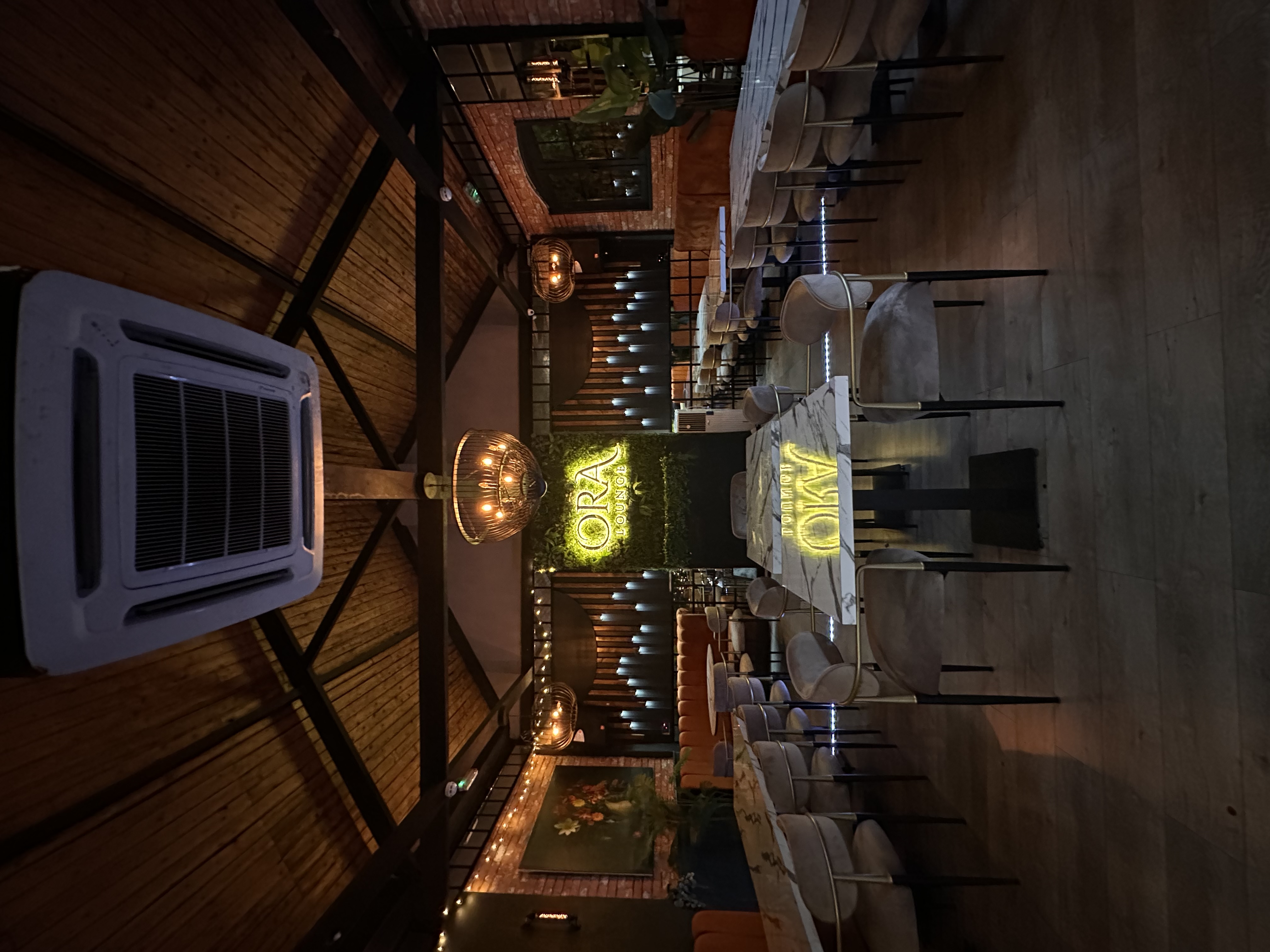 Stylish Ora Lounge event space with chandeliers, perfect for networking and private dinners.