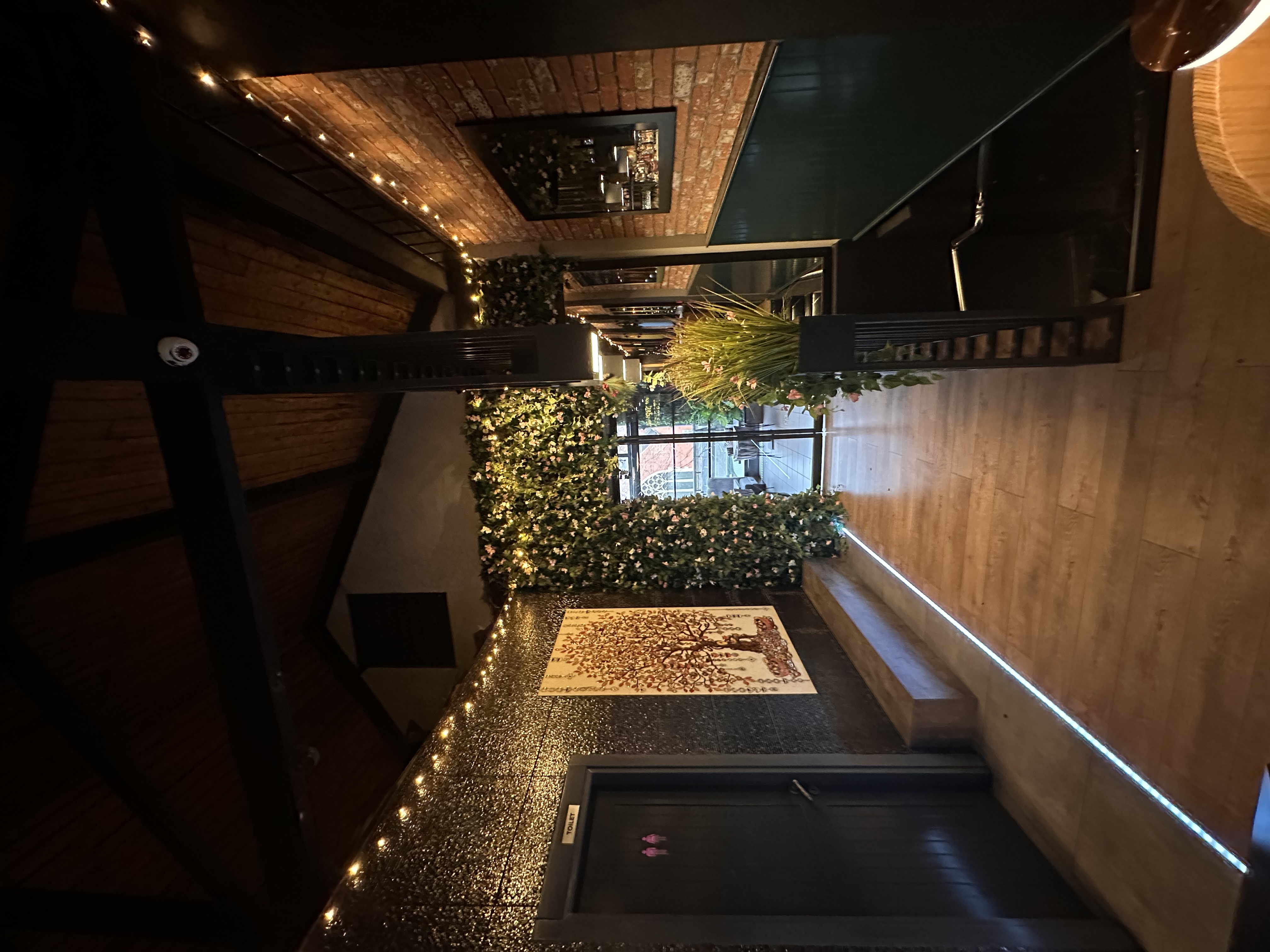 Stylish Ora Lounge entrance with modern decor, perfect for intimate gatherings and events.