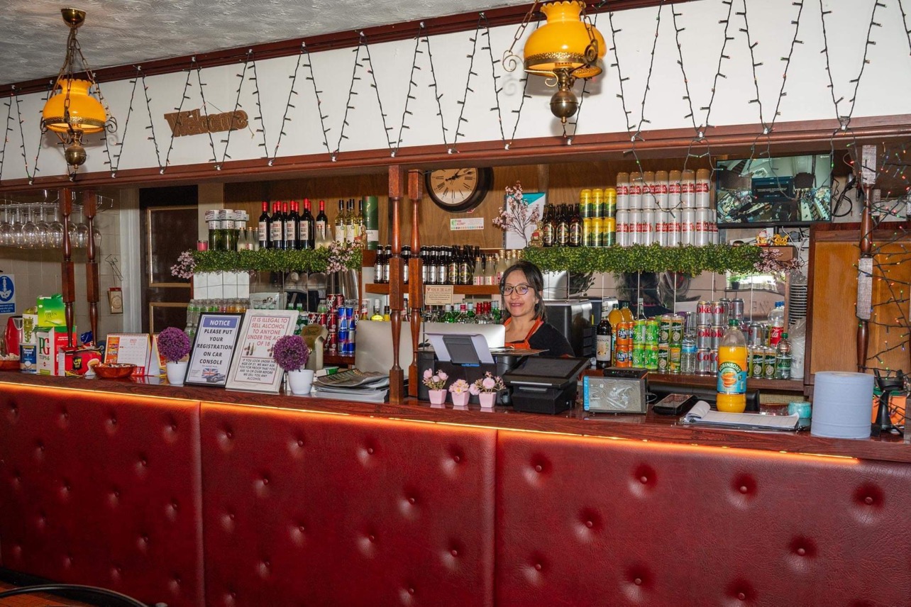 Churchill Hotel bar area with warm lighting, perfect for events and gatherings.