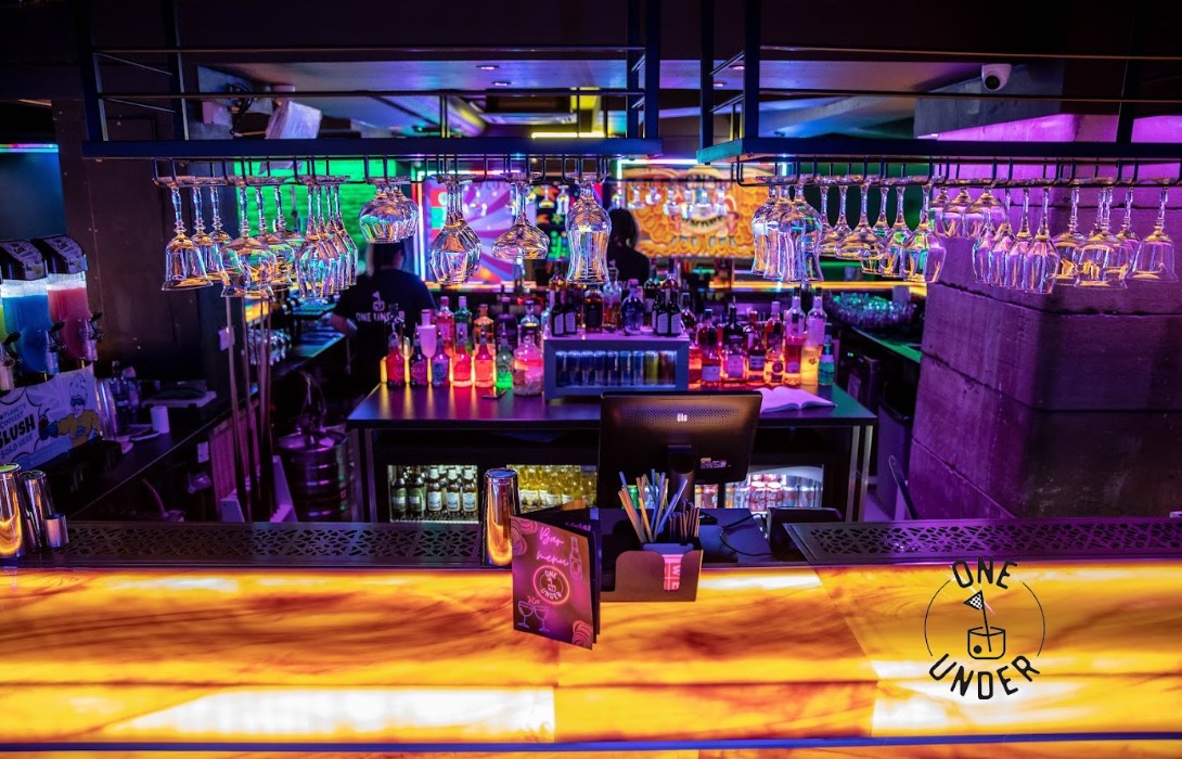 Vibrant GlasVegas bar in Glasgow with colorful lighting, ideal for events and gatherings.