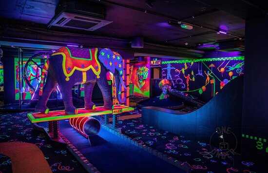 Vibrant mini-golf venue with elephant sculpture for team-building events in Glasgow.