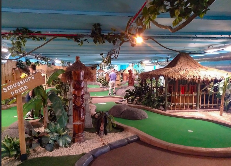 Vibrant indoor mini-golf at Jungle Rumble Birmingham for team-building events.