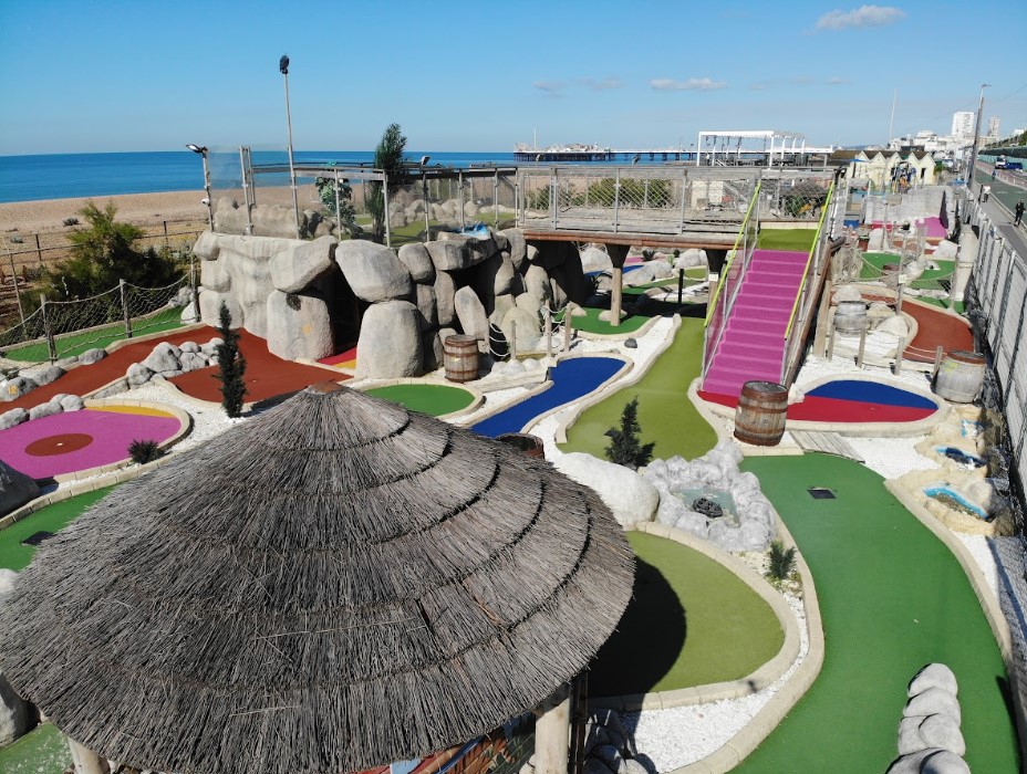Caveman Course mini-golf in Brighton, colorful greens for team-building and family events.