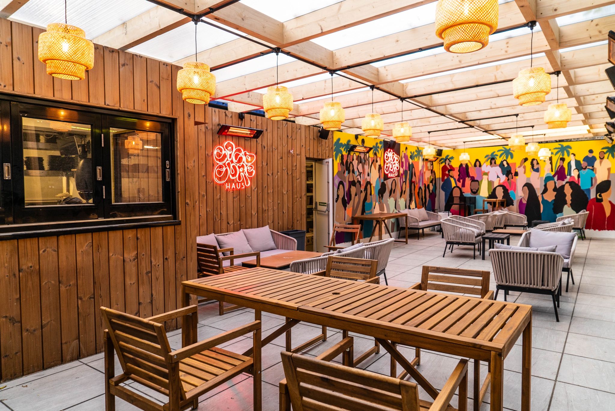 Vibrant Cococure Haus event space with wooden accents, ideal for networking and gatherings.