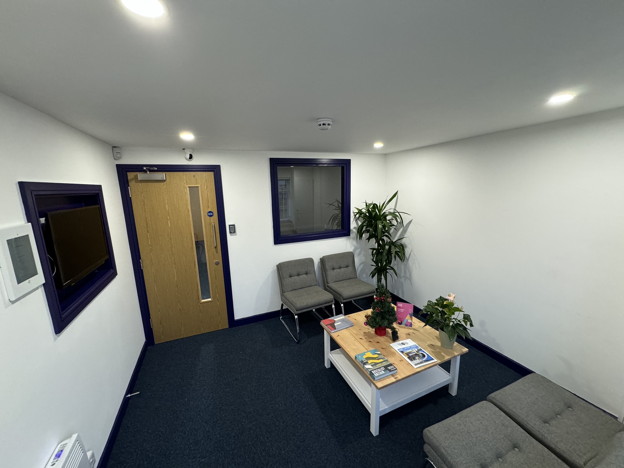 Modern UK training centre waiting area with comfortable seating for events and meetings.