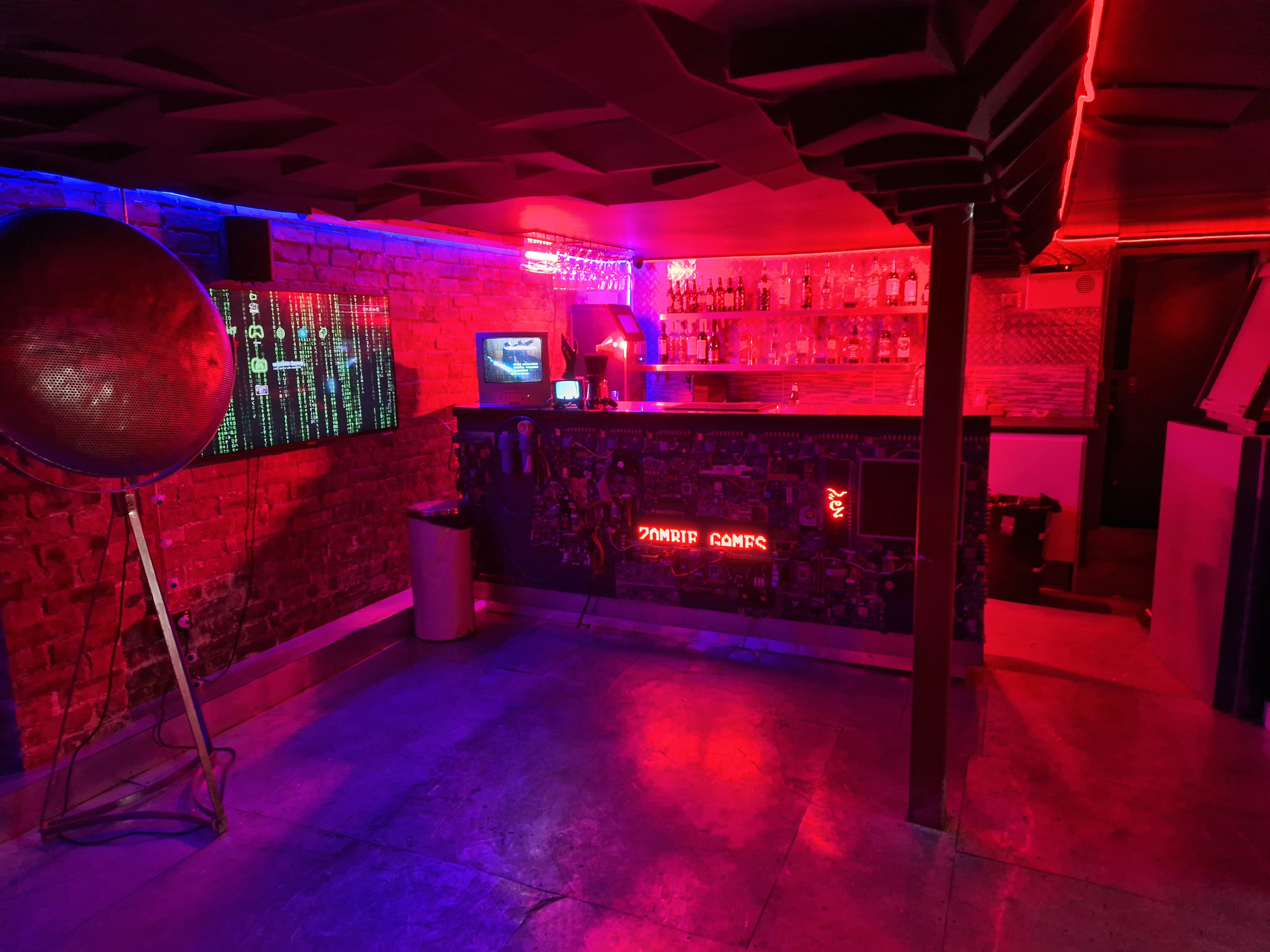 Zombie Games Cafe: vibrant event space with neon lights for themed gatherings and social events.