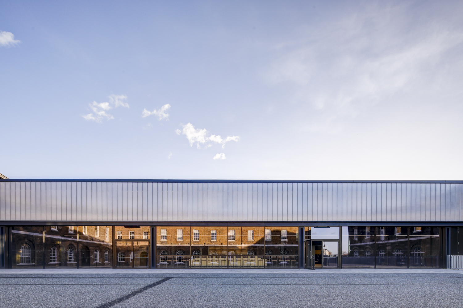 Modern event space in Woolwich Works with large glass windows for corporate and social gatherings.