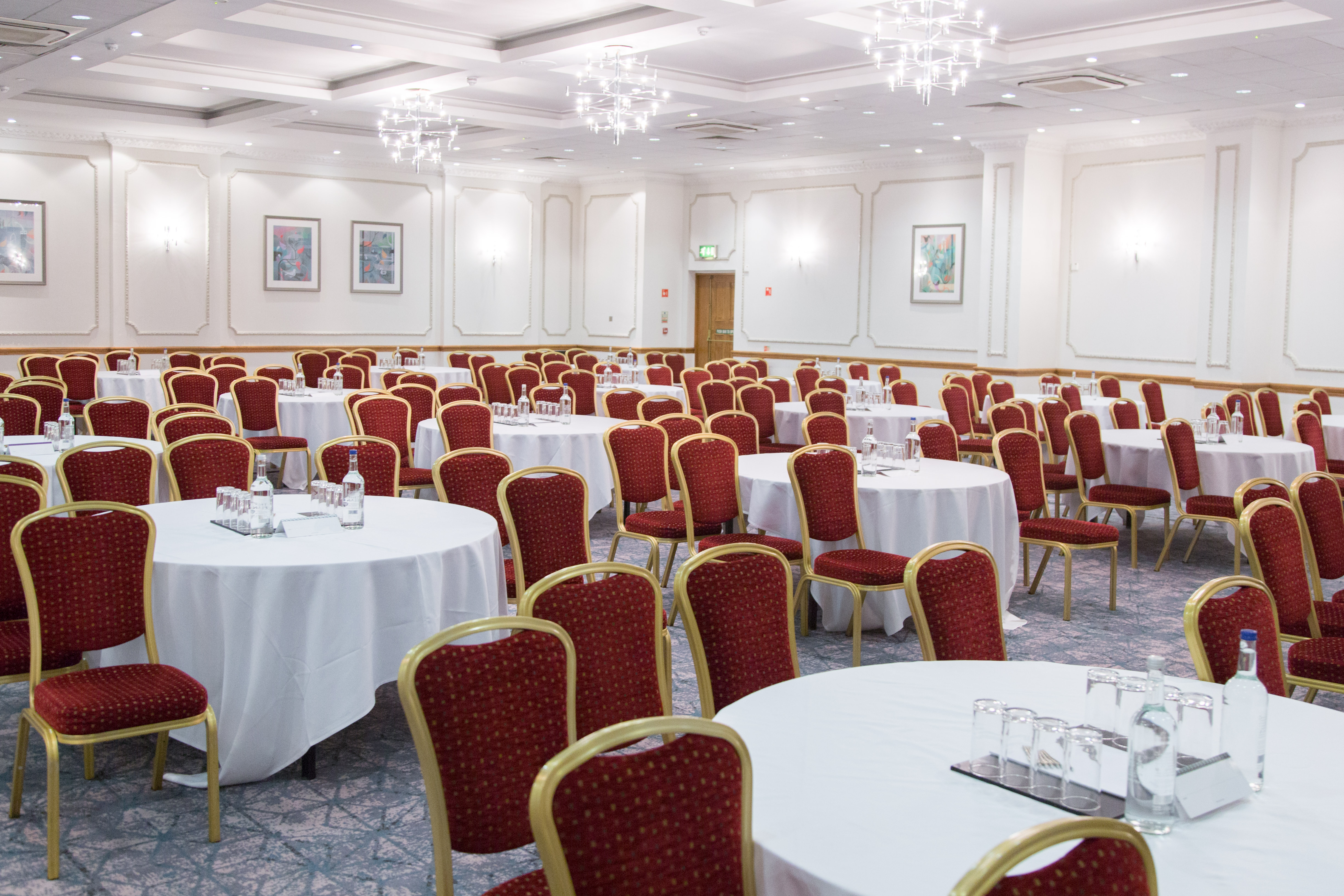Wessex Suite event space with round tables, ideal for conferences and banquets.