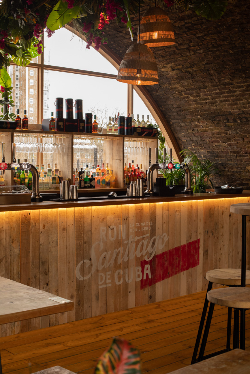 Stylish bar at The Arches, Pergola Brixton, ideal for networking events and cocktail hours.