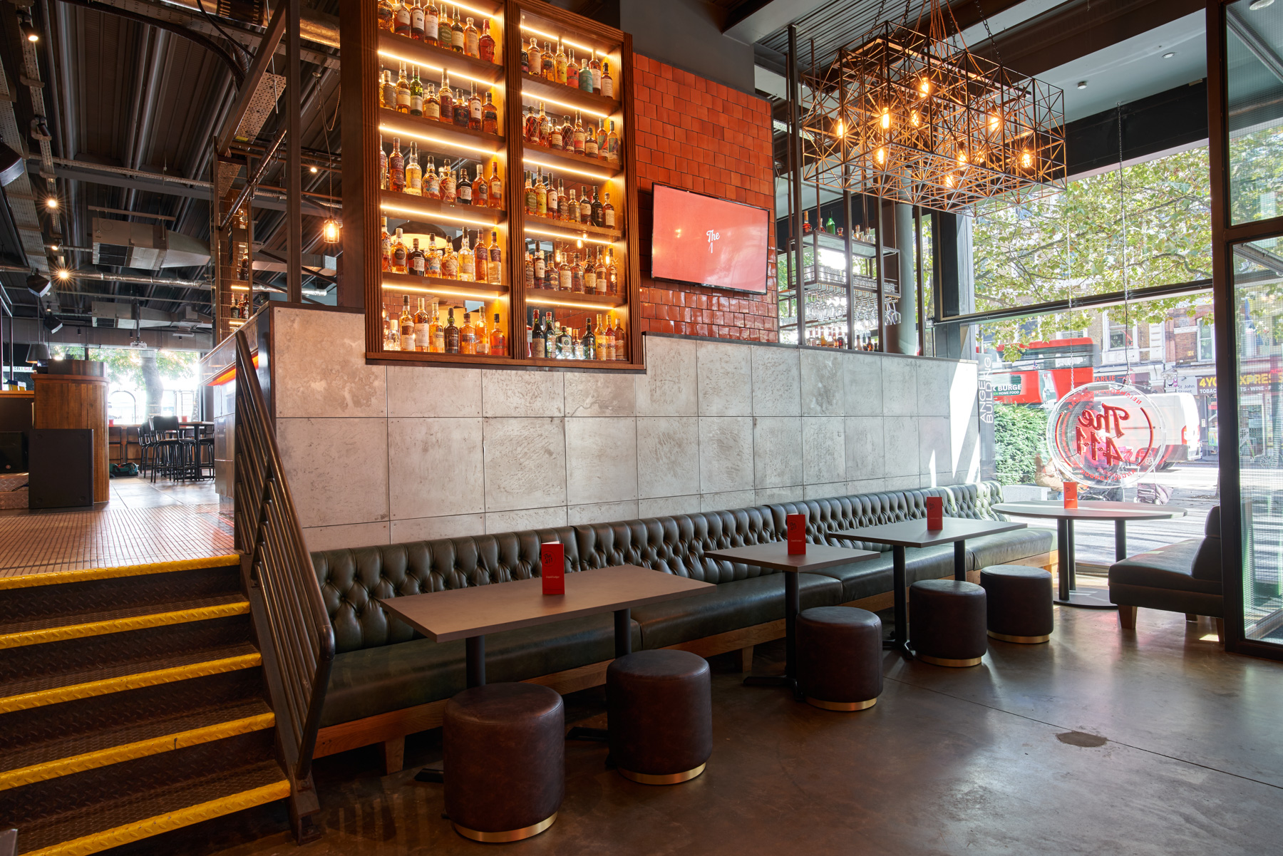 Modern venue with inviting bar, ideal for casual meetings and networking events.