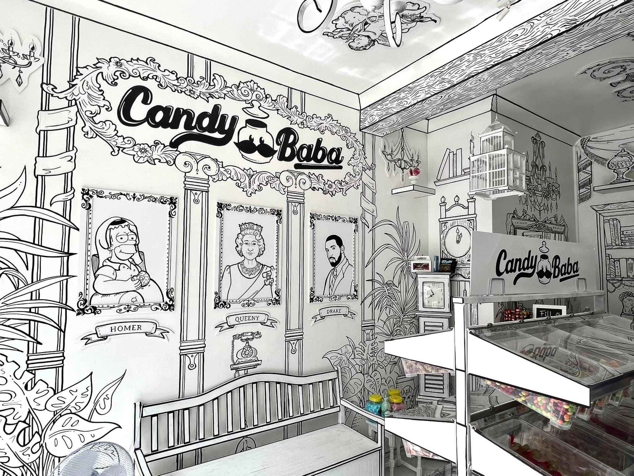 Whimsical candy shop interior with hand-drawn mural for themed events and gatherings.
