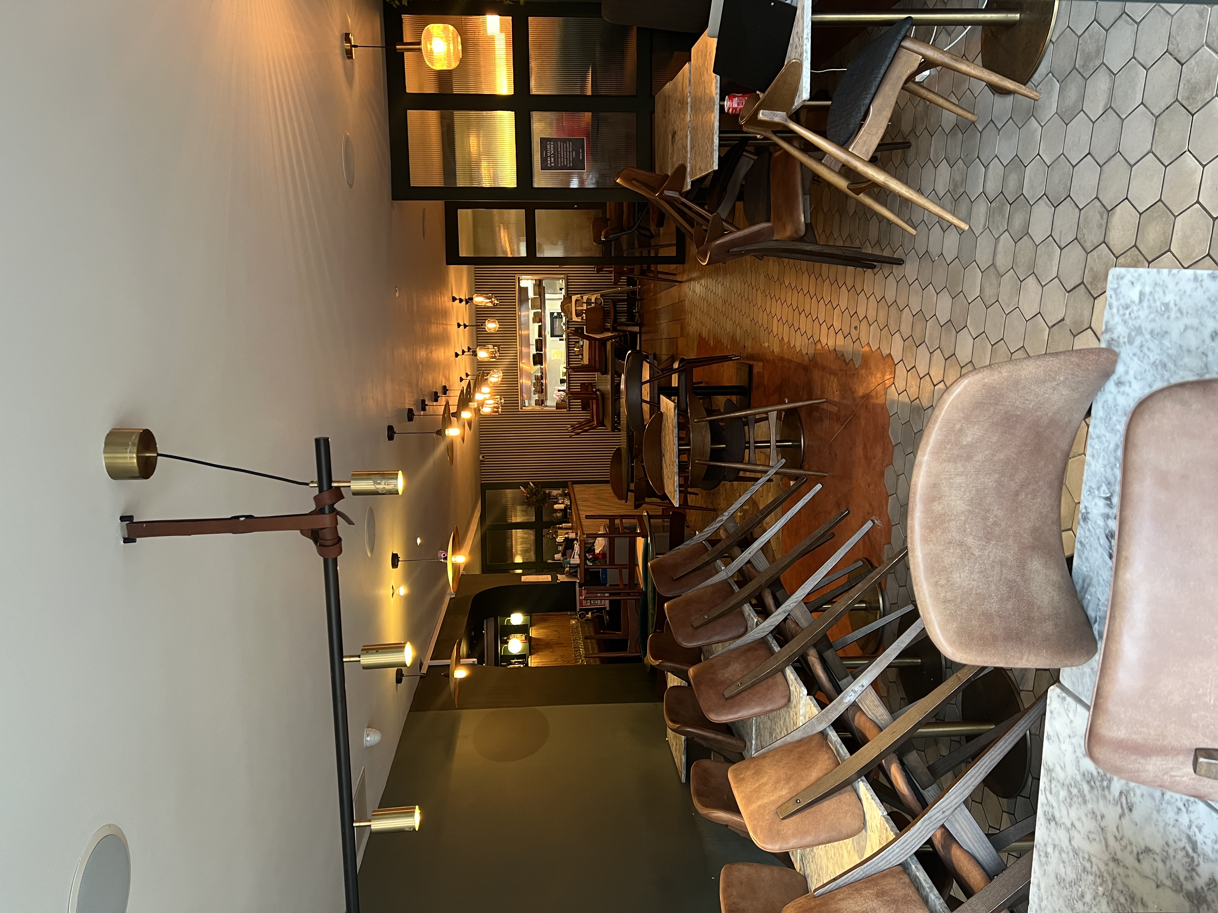 Versatile event space with modern decor, ideal for casual dining and networking events.