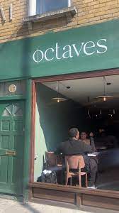 Welcoming kitchen venue with green door, perfect for intimate meetings and events.