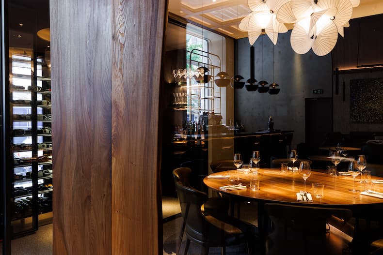 Sophisticated dining space with warm wood tones for intimate events and private dinners.