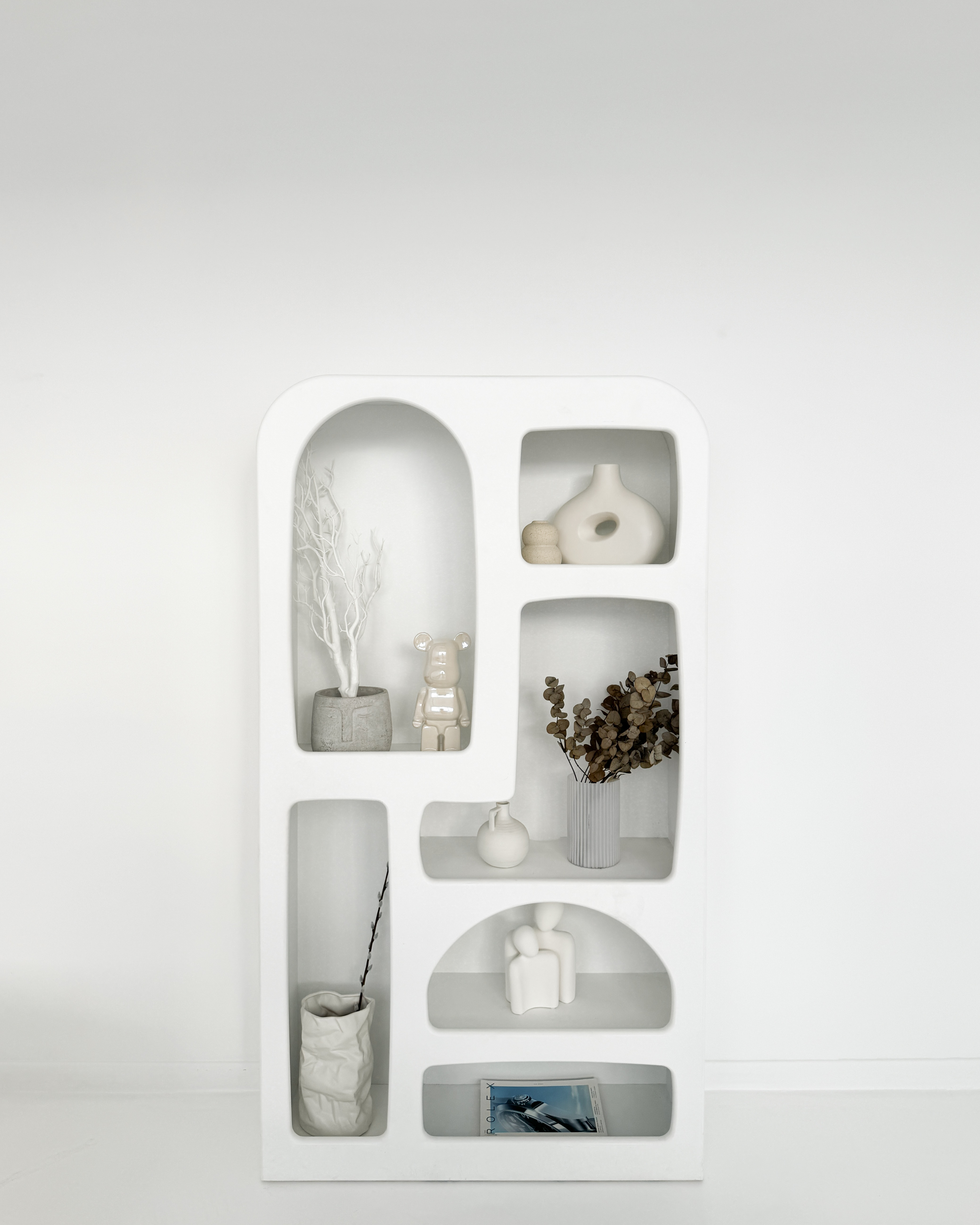 Modern shelving unit with decorative vases in Sumei Studios event space.