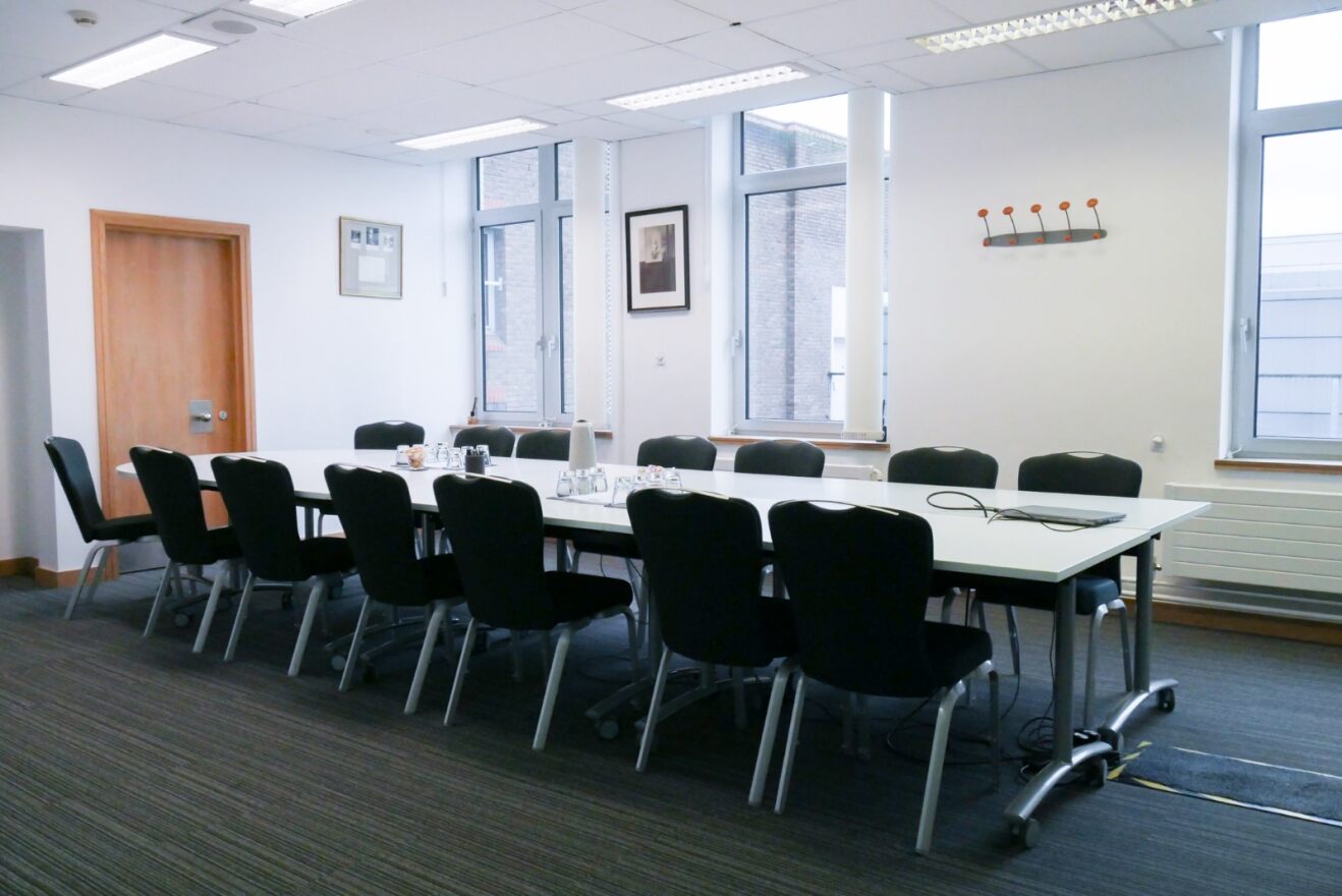 Bright 4th Floor Meeting Room at 1 Wimpole Street, ideal for presentations and brainstorming.