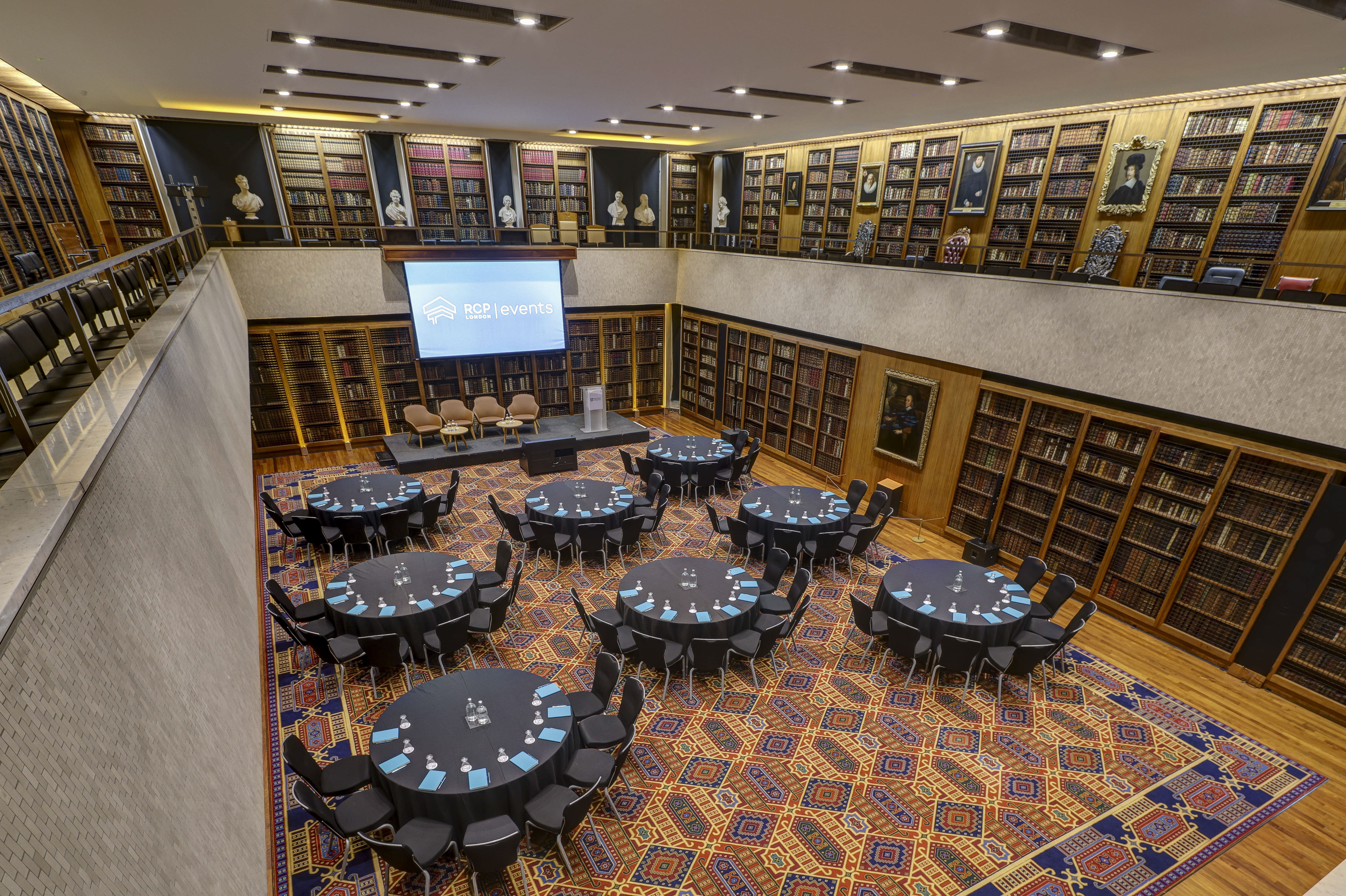 Dorchester Library event space with round tables, ideal for meetings and conferences.