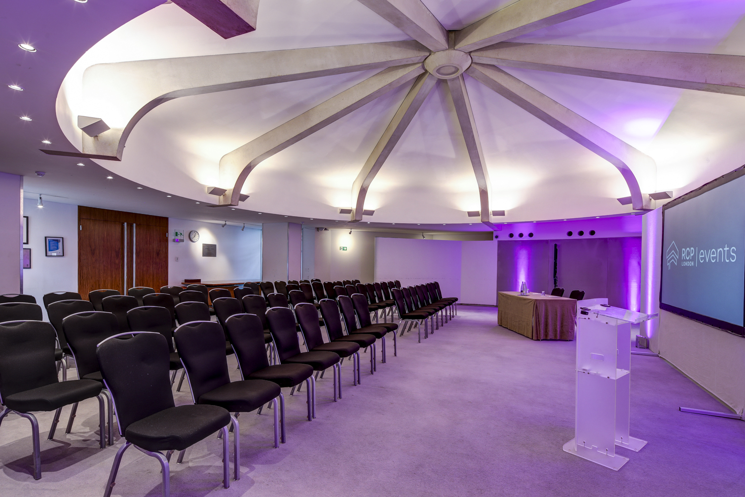 Modern Council Chamber with tiered seating for corporate and creative events in RCP London.