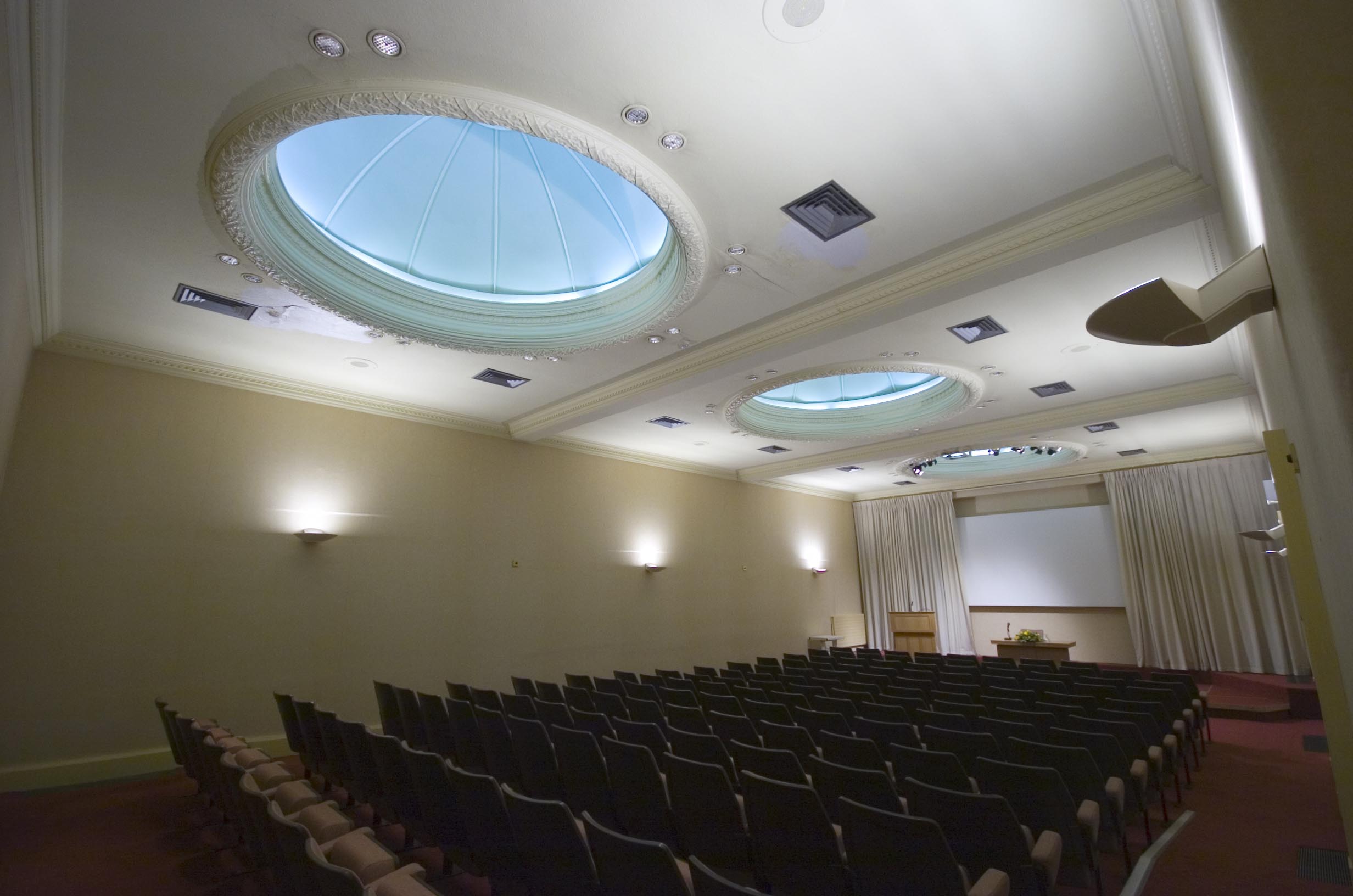 Wolfson Lecture Theatre, spacious conference room with skylights for seminars and events.