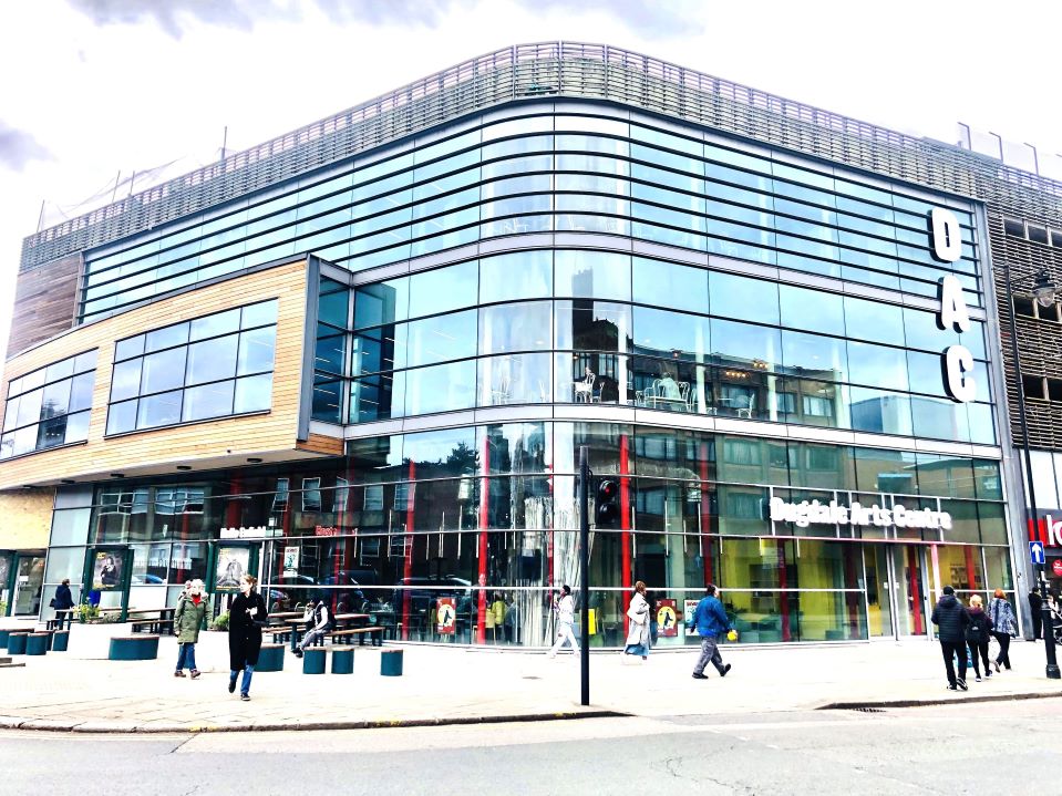 Modern event venue with sleek glass facade at Dugdale Arts Centre, ideal for conferences.