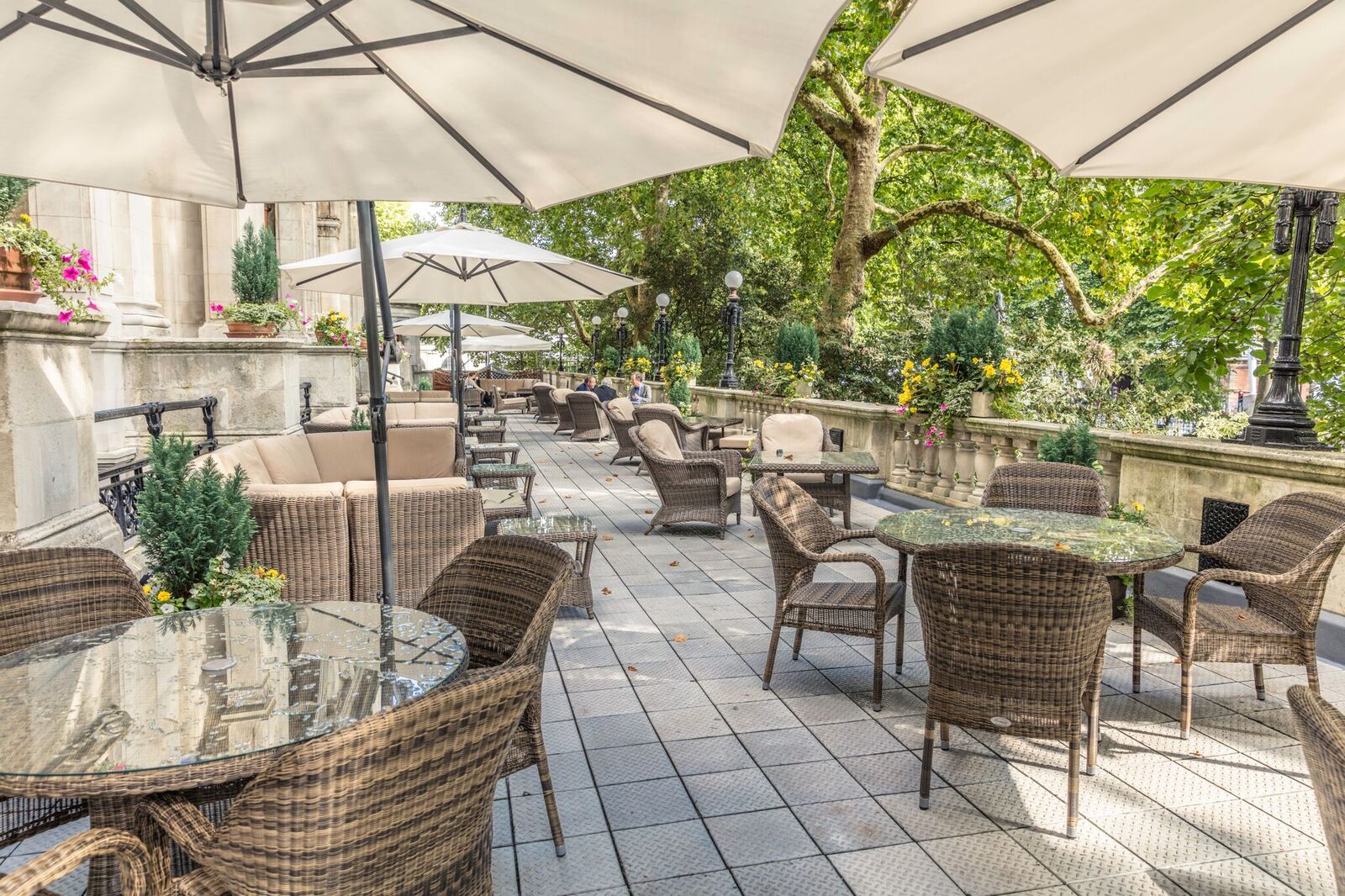 Outdoor terrace at National Liberal Club, ideal for networking events with lush greenery.