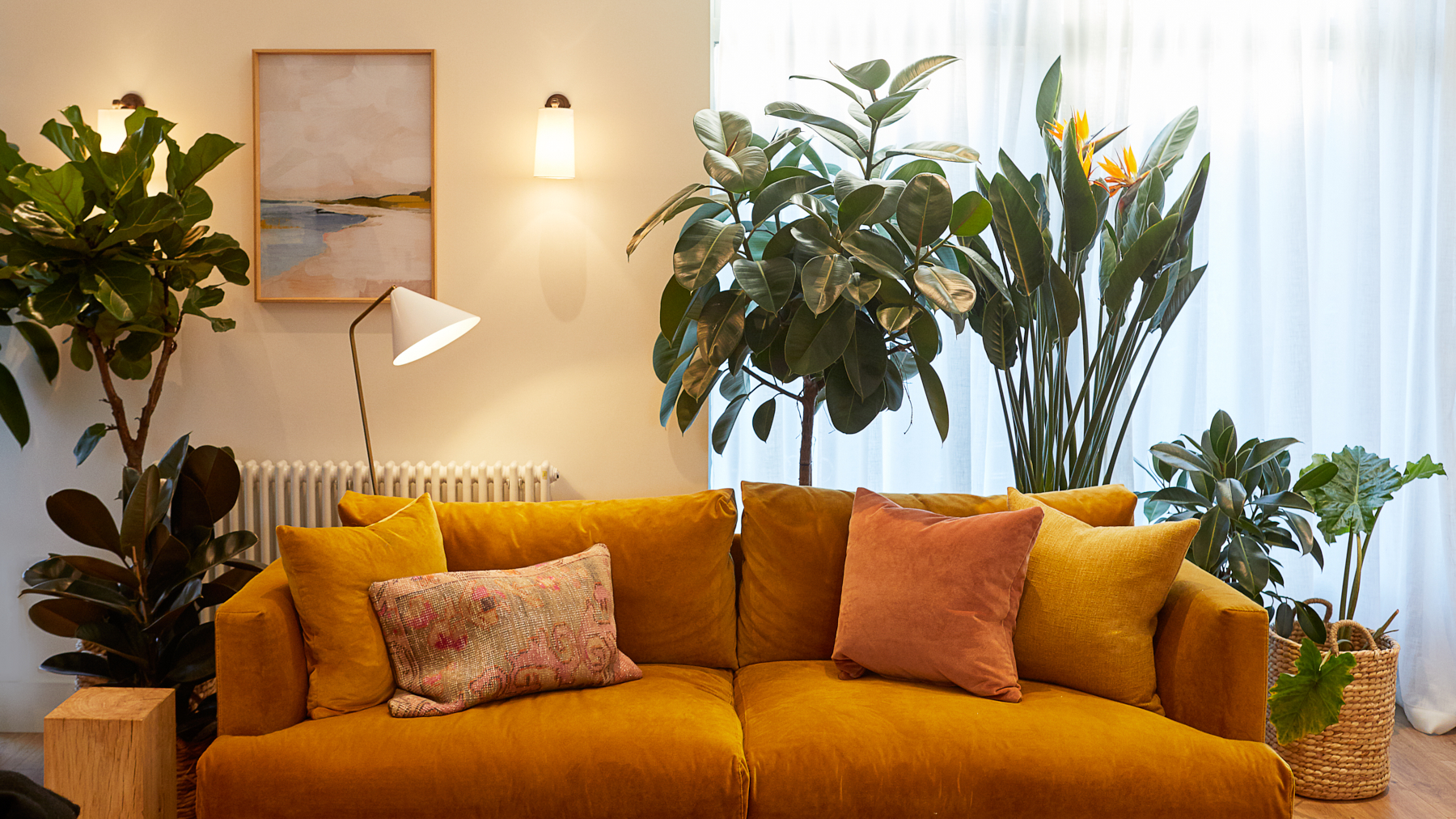 Cozy lounge with mustard sofa, ideal for informal meetings and networking events.