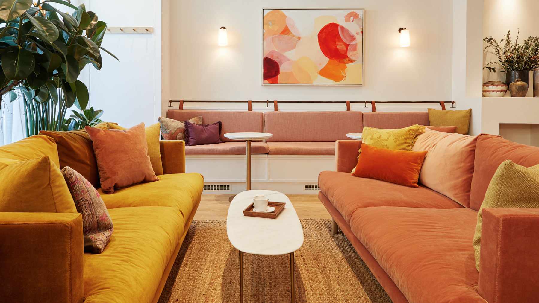 Stylish lounge area with warm colors, ideal for networking and casual meetings.