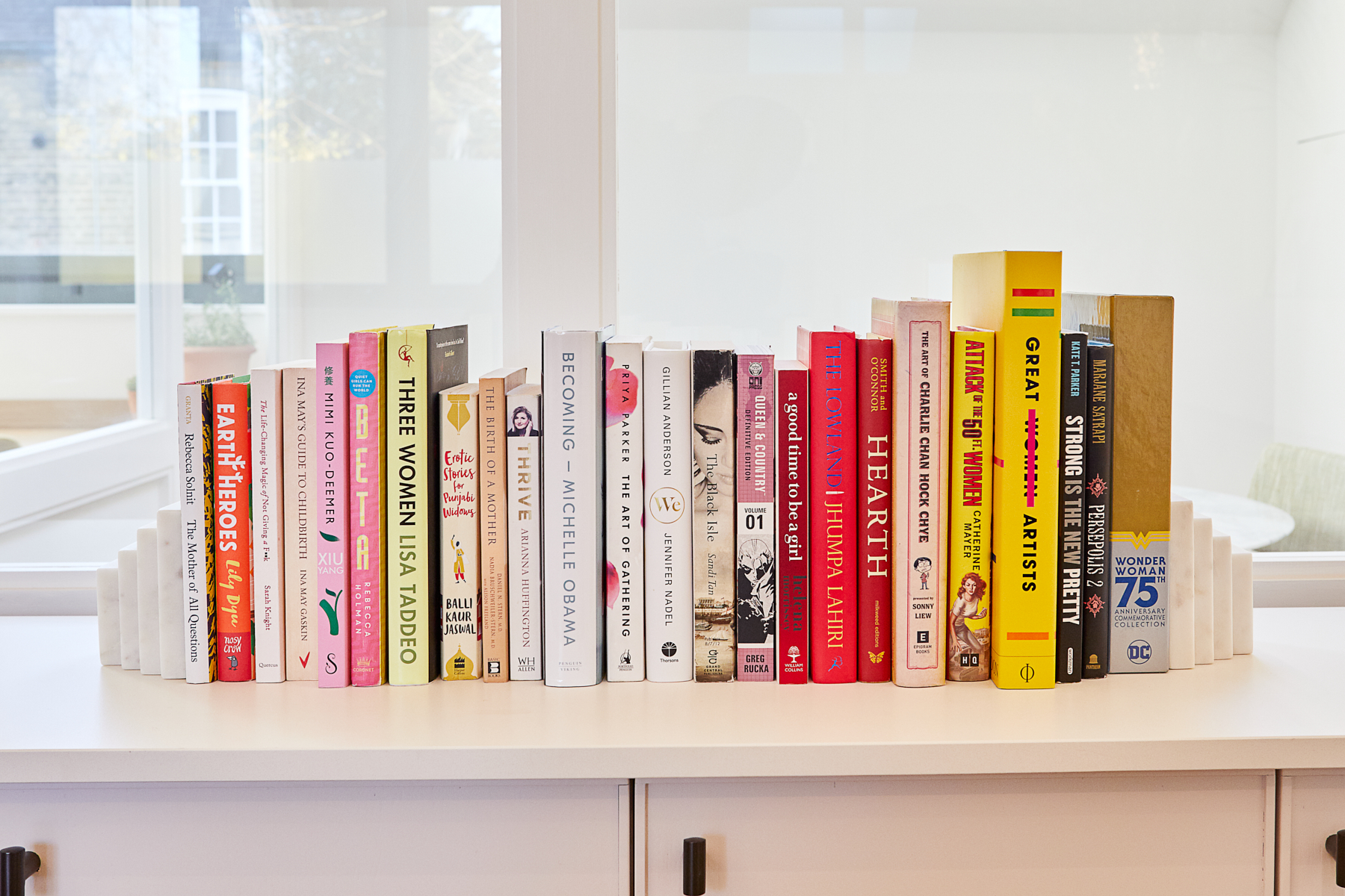 Colorful book display in The Library at The Hearth for creative meetings and events.