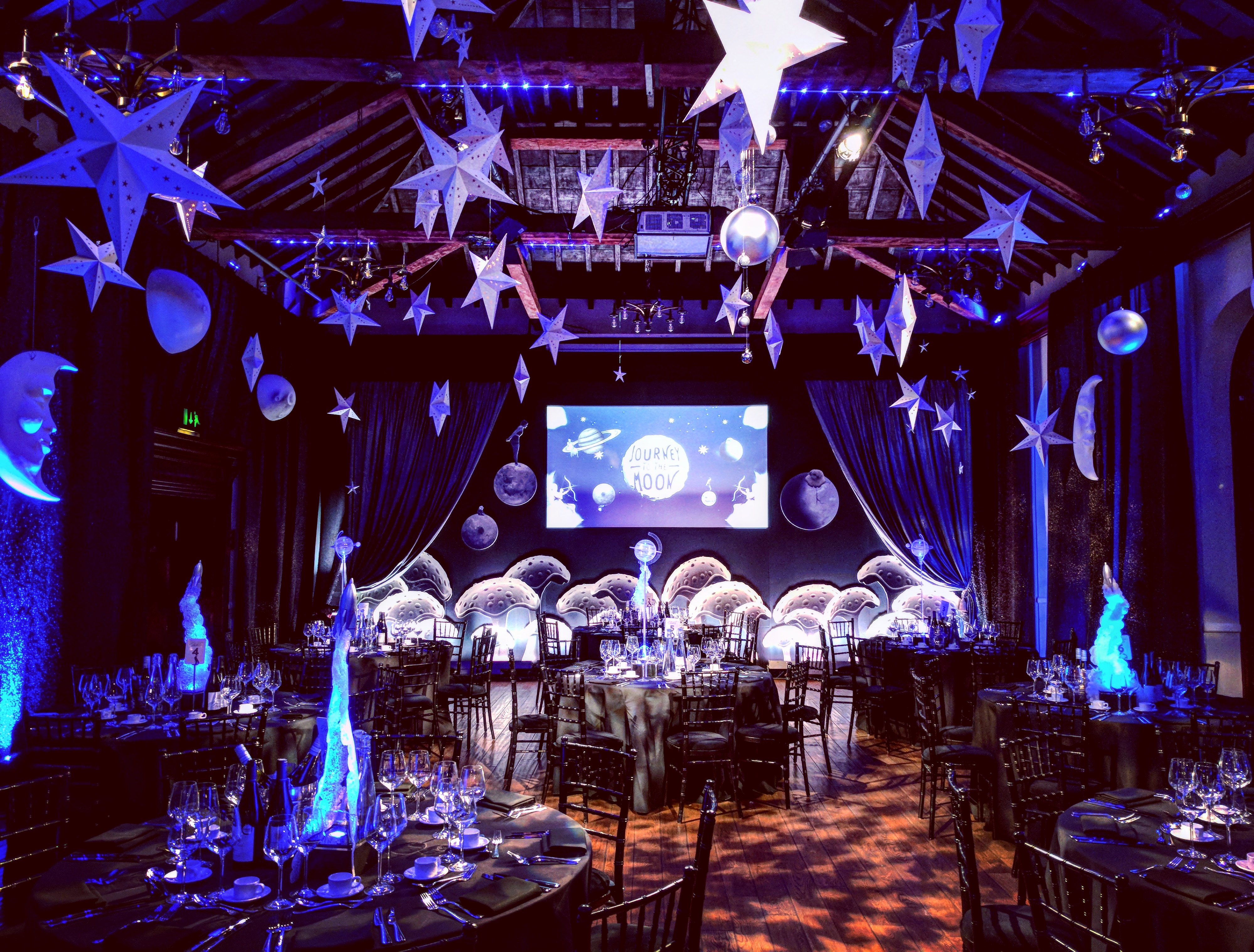 Christmas party venue with celestial decor and elegant dining setup in The Brewery.