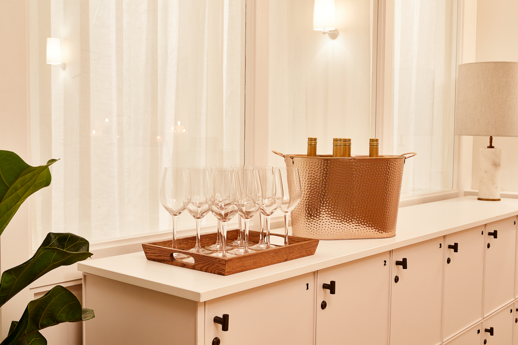 Elegant event setup in The Hearth Library with champagne flutes and chic decor.