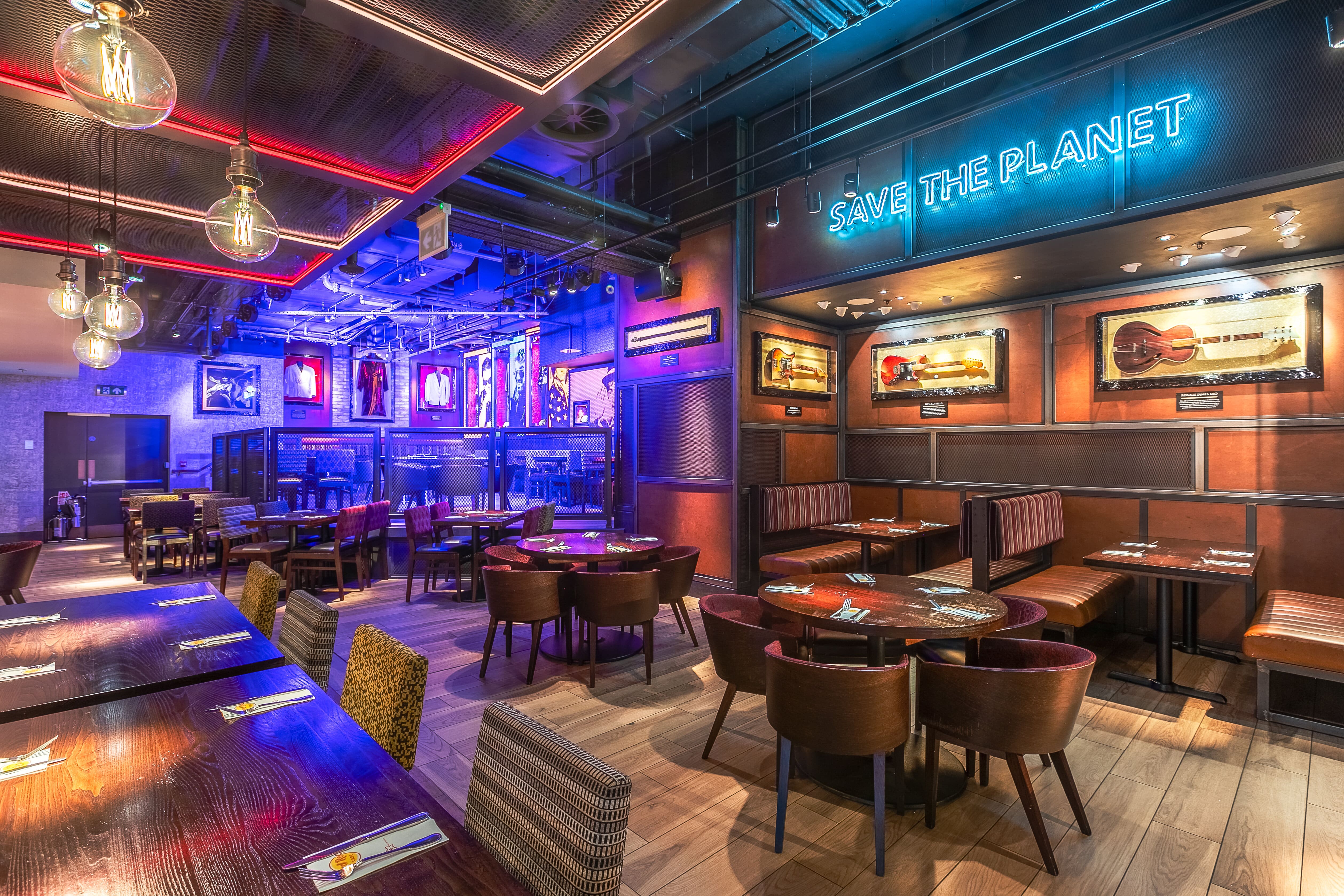 Vibrant event space at Hard Rock Cafe Piccadilly Circus with stylish seating and neon lights.