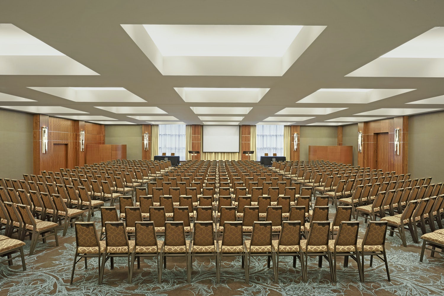 Spacious conference room at Sheraton Grand Hotel, ideal for seminars and corporate meetings.