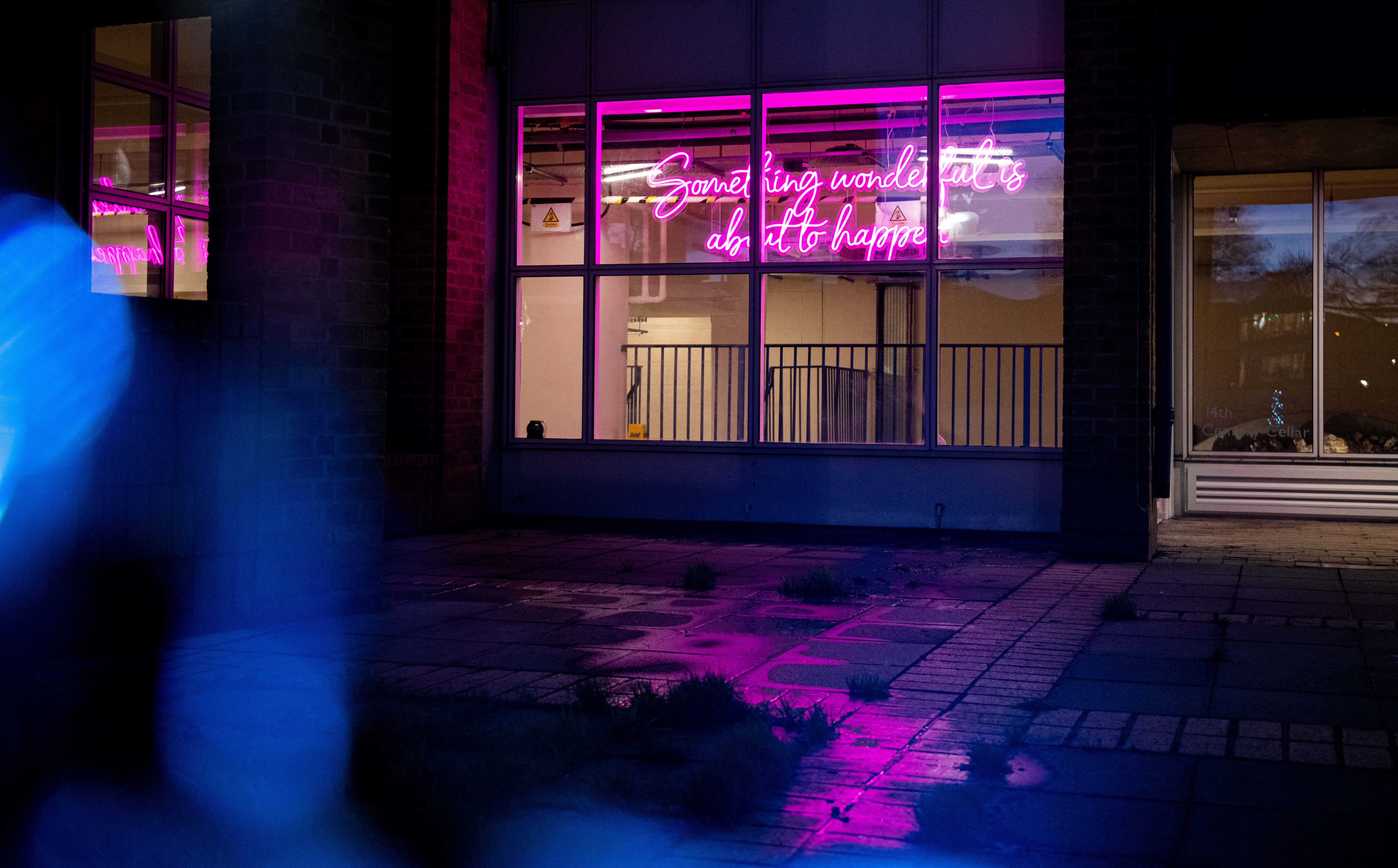 Vibrant FUSEBOX venue with neon sign, perfect for creative events and parties.