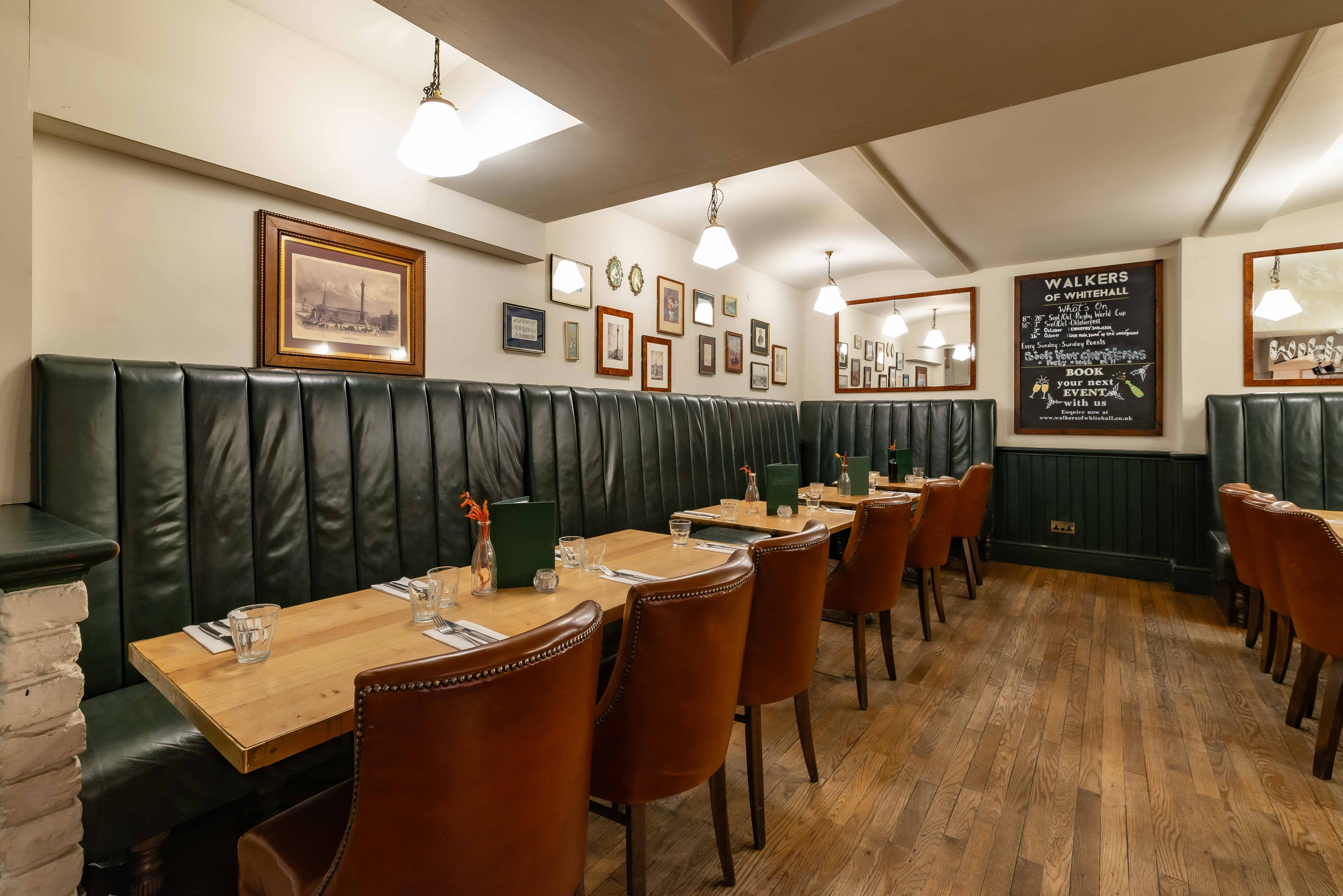 Elegant dining room with leather seating, perfect for intimate meetings and events.