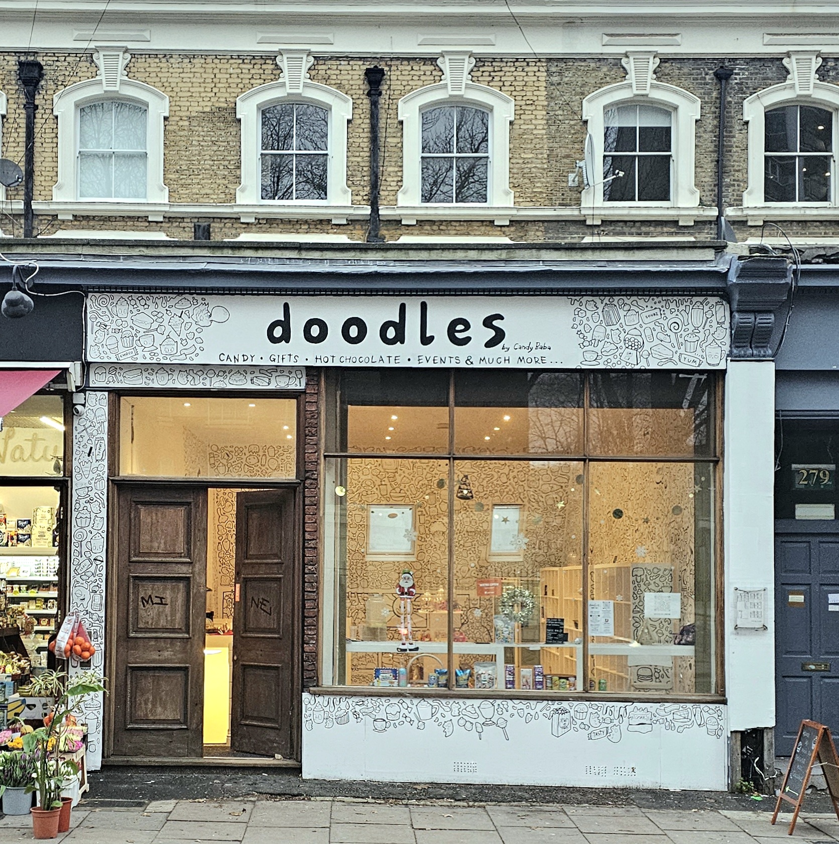 Charming Doodles gallery showroom with large windows, perfect for creative events and meetings.