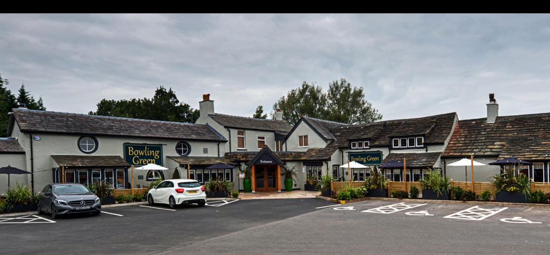 Charming Bowling Green venue with greenery, perfect for events and meetings.