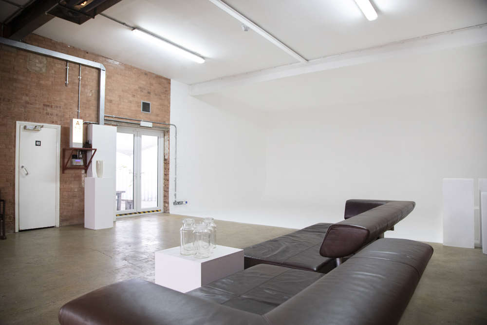 Versatile event space in Bow Bunker, East London with exposed brick walls and natural light.