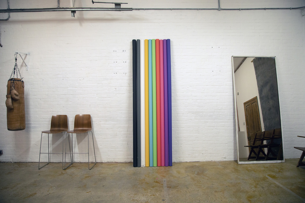 Versatile event space in Bow Bunker, East London with colorful backdrop for workshops.