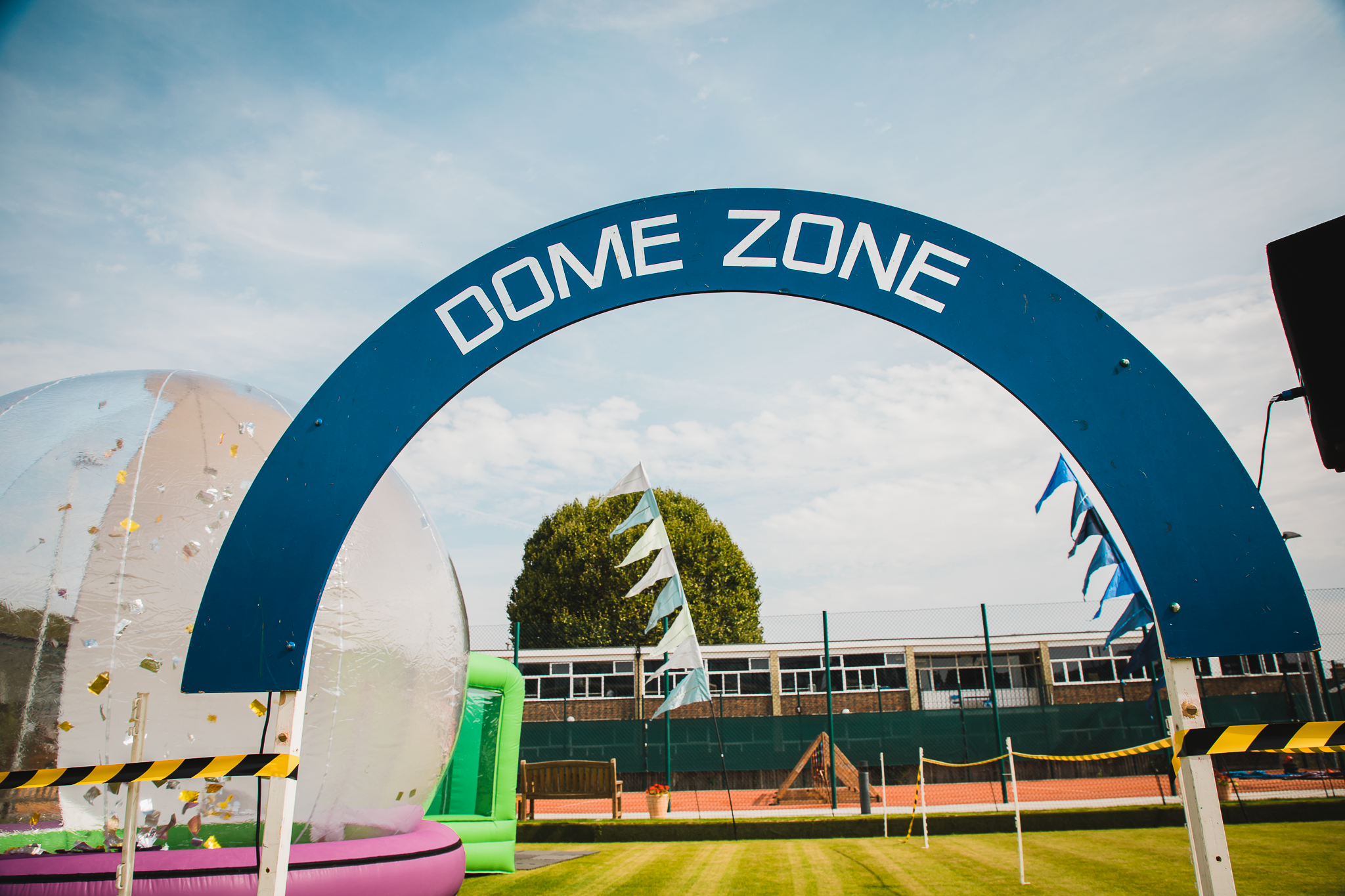 Parson Lawns event space with "DOME ZONE" archway for family-friendly festivals.