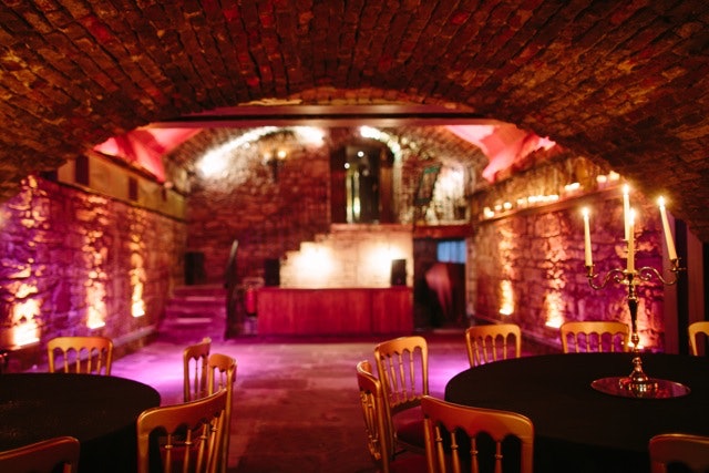 Vaulted Cellars event space with stone walls, ideal for private gatherings and dinners.