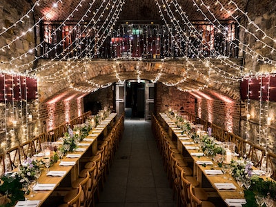 Elegant banquet table in Vaulted Cellars, perfect for weddings and upscale events.